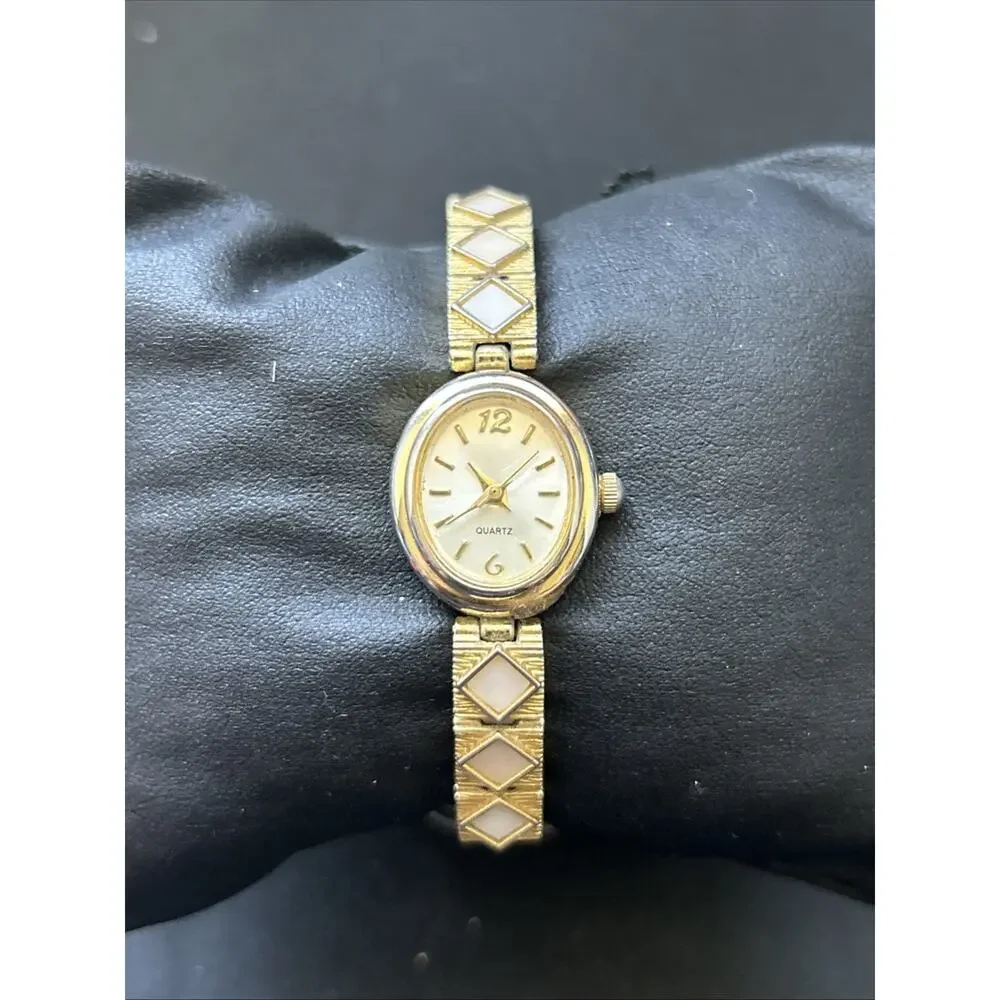 Gold Tone Oval Case Women’s Stretch Band Quartz Watch